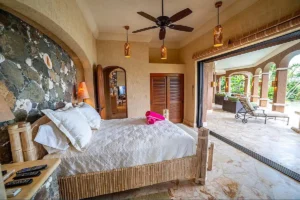 a luxurious bedroom in seacove villa looking out onto the Caribbean sea.